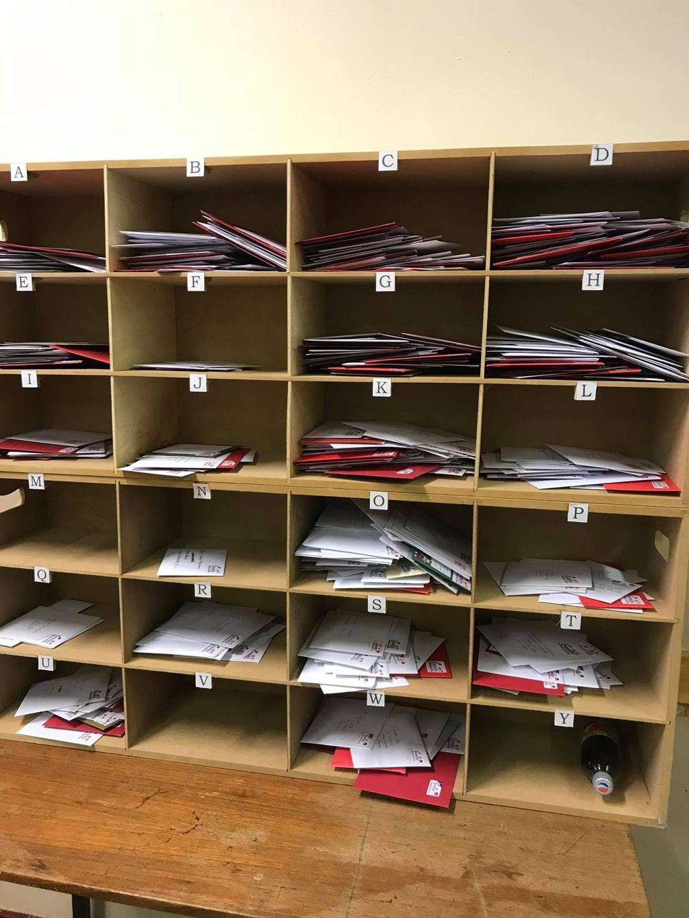 Pigeonholes full of Christmas cards sorted by delivery round